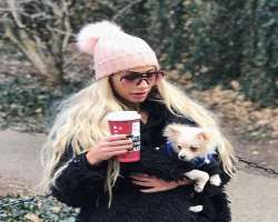 She is an animal lover and has a cute pomeranian dog in her home.